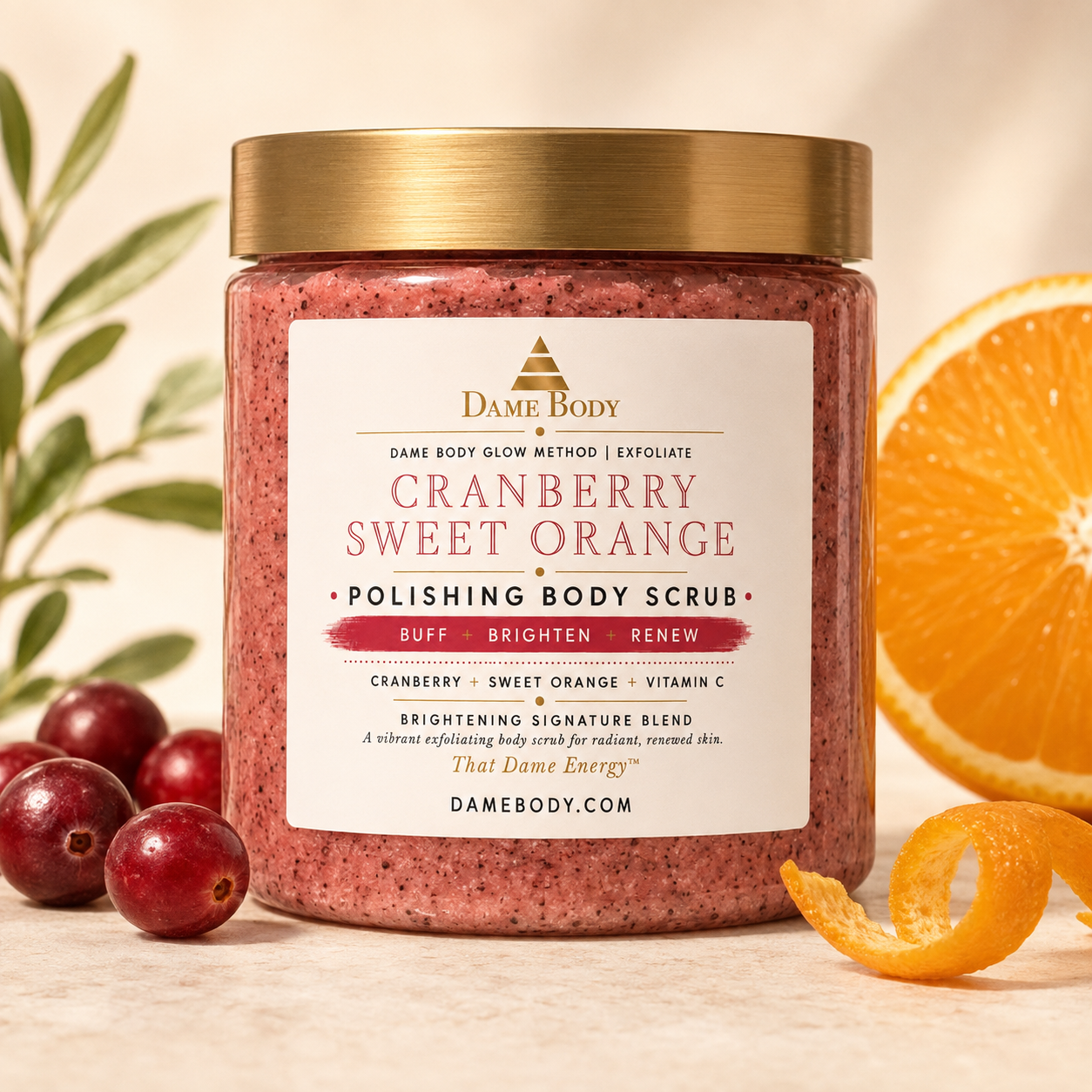 Cranberry Sweet Orange Polishing Body Scrub by Dame Body in a clear jar with berry-toned scrub texture, cranberries, and sliced sweet orange.