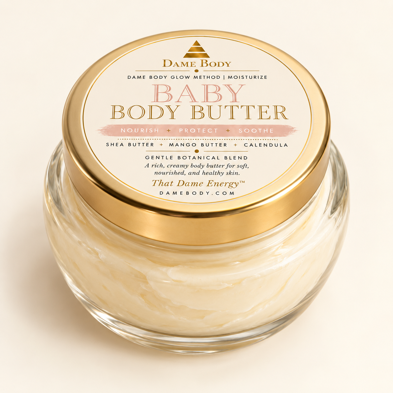 Dame Body Baby Body Butter in 8 oz clear glass tureen jar with gold lid and circular label