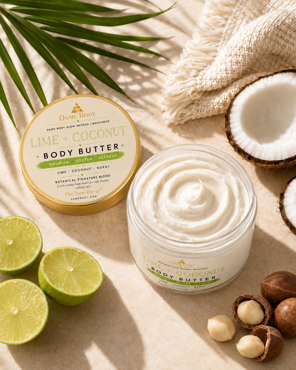 Open Lime + Coconut Body Butter with its approved green-and-gold lid label, creamy texture, coconut and sliced lime.