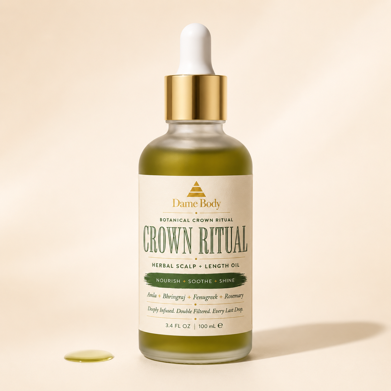 Crown Ritual Herbal Scalp + Length Oil in a 3.4 fl oz frosted glass bottle with gold dropper and the cream, green and gold Dame Body label.