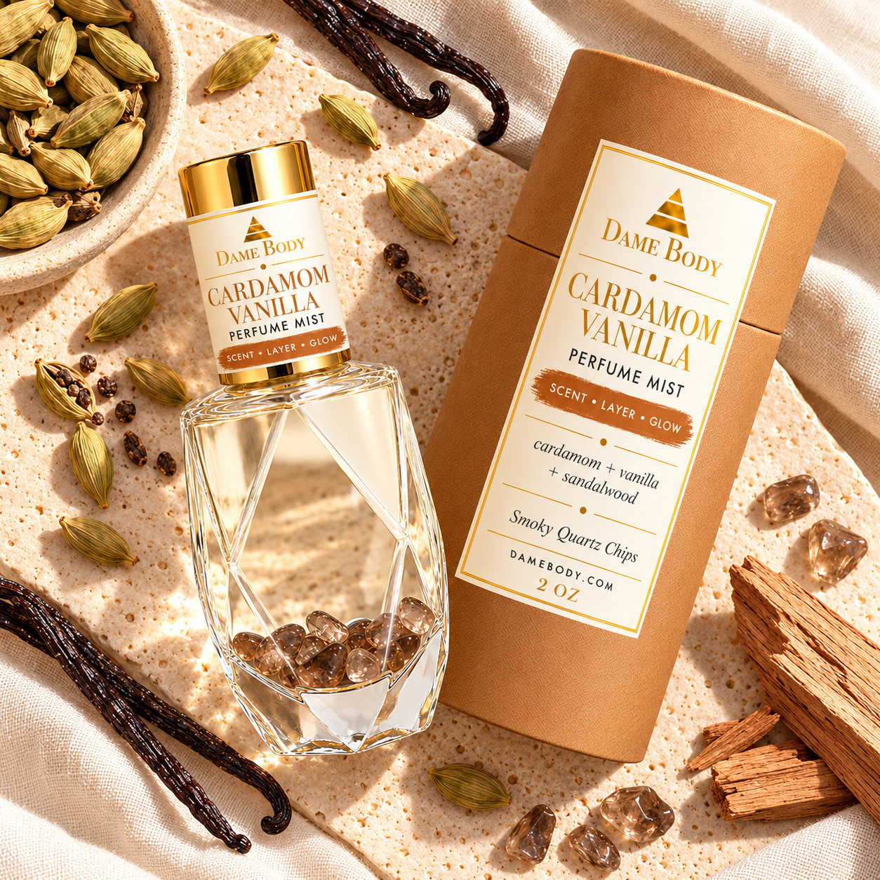 Cardamom Vanilla Perfume aroma flat lay with smoky quartz chips, cardamom pods, vanilla beans and sandalwood.