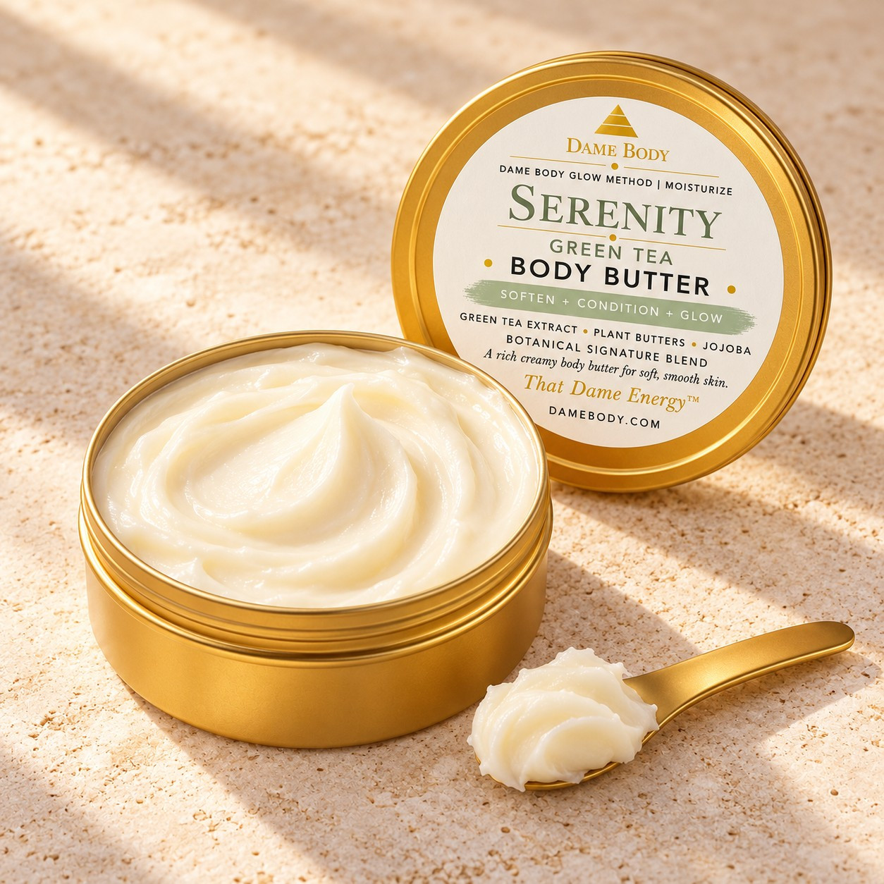 Open 4oz gold tin showing creamy body butter beside the current Serenity Green Tea label and a gold scoop.