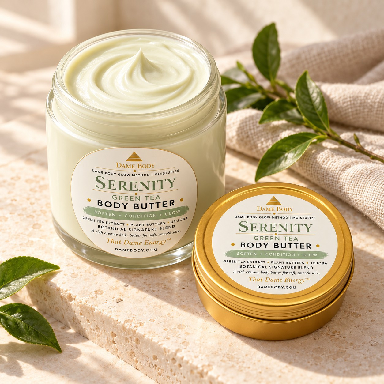 Serenity Green Tea Body Butter in a larger glass jar paired with the smaller current-label 4oz gold metal tin; products sold separately.