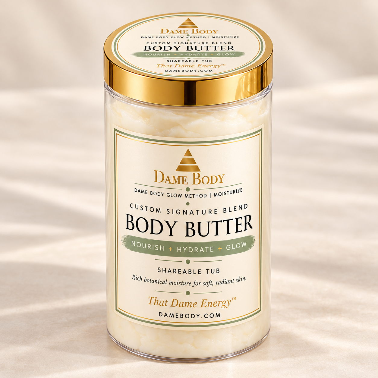 Current 32 oz Shareable Body Butter in the replacement tall clear jar with a gold lid, rectangular front label and matching round lid label.