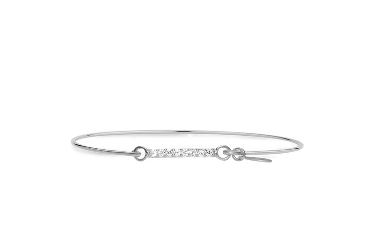 Perfectly pavé!  Bling that layers and mixes with all of your bracelet favorites.  These iconic designs add meaning and symbolism to any stack.  The signature stia open-and-close "hook" design appears seamless around the wrist and is lightweight and easy to wear.  

• Precious .925 sterling silver with rhodium plating
• Size: 2.25" diameter, 7" circumference
• Pavé CZ stones in a clustered iconic design form
• Stia seamless "hook" design for opening and closing

Stack & layer with "something simple, something symbolic, and something sparkly"!