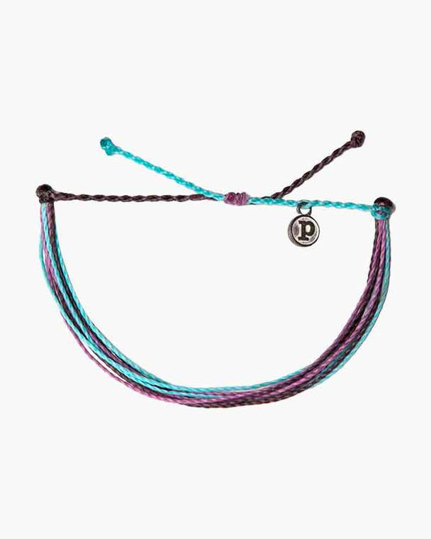 You'll be looking so "berry cute" with this colorful bracelet from Pura Vida in shades of blue, purple, and black! Made from 100% waterproof cord and so much fun to wear and layer, it can follow you anywhere spring and summer take you - with a little boho flair thrown in!

Adjustable from 2-5 Inches in Diameter
Wax-coated cord is 100% waterproof
Pura Vida logo charm