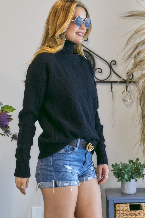 This sweater is a dream! With its oh so soft, stretchy fabric, the fit is flattering on all shapes and sizes! It has a faint cable knit design incorprated that adds to its style! Looks great with leggings and jeans. Can easily be dressed up or down. Fits true to size.