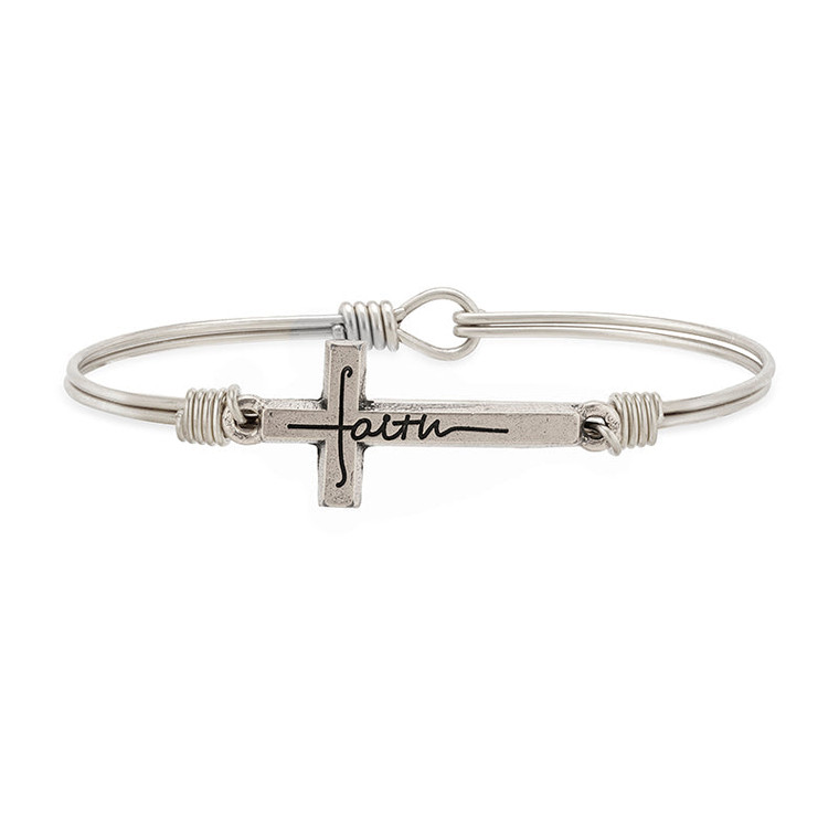 Wear your faith on your wrist. We designed a bangle bracelet for that. The beautifully crafted matte cross is cleverly engraved with the inscription. An elegant reminder to have faith and believe.n.
Handmade using artisan metals
Easy hook and catch closure
Oval shape ensures proper fit
Silver tone finish
Includes an essence card
Made in the USA
