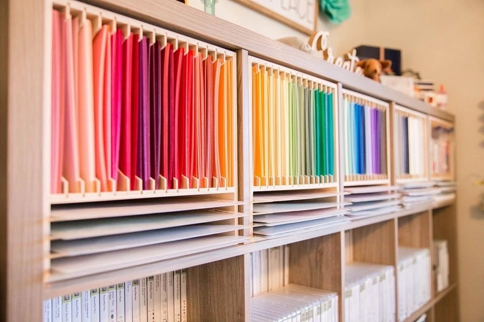 Anastasia's cardstock and Designer Series Paper stored in the Stamp-n-Storage 8.5x11 Max for IKEA Kallax