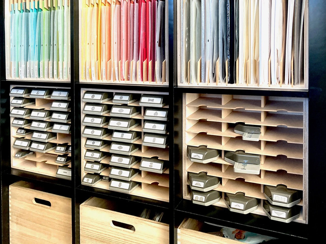 Kim's craft room with 12x12 cardstock arranged in rainbow order in Stamp-n-Storage Paper Holders