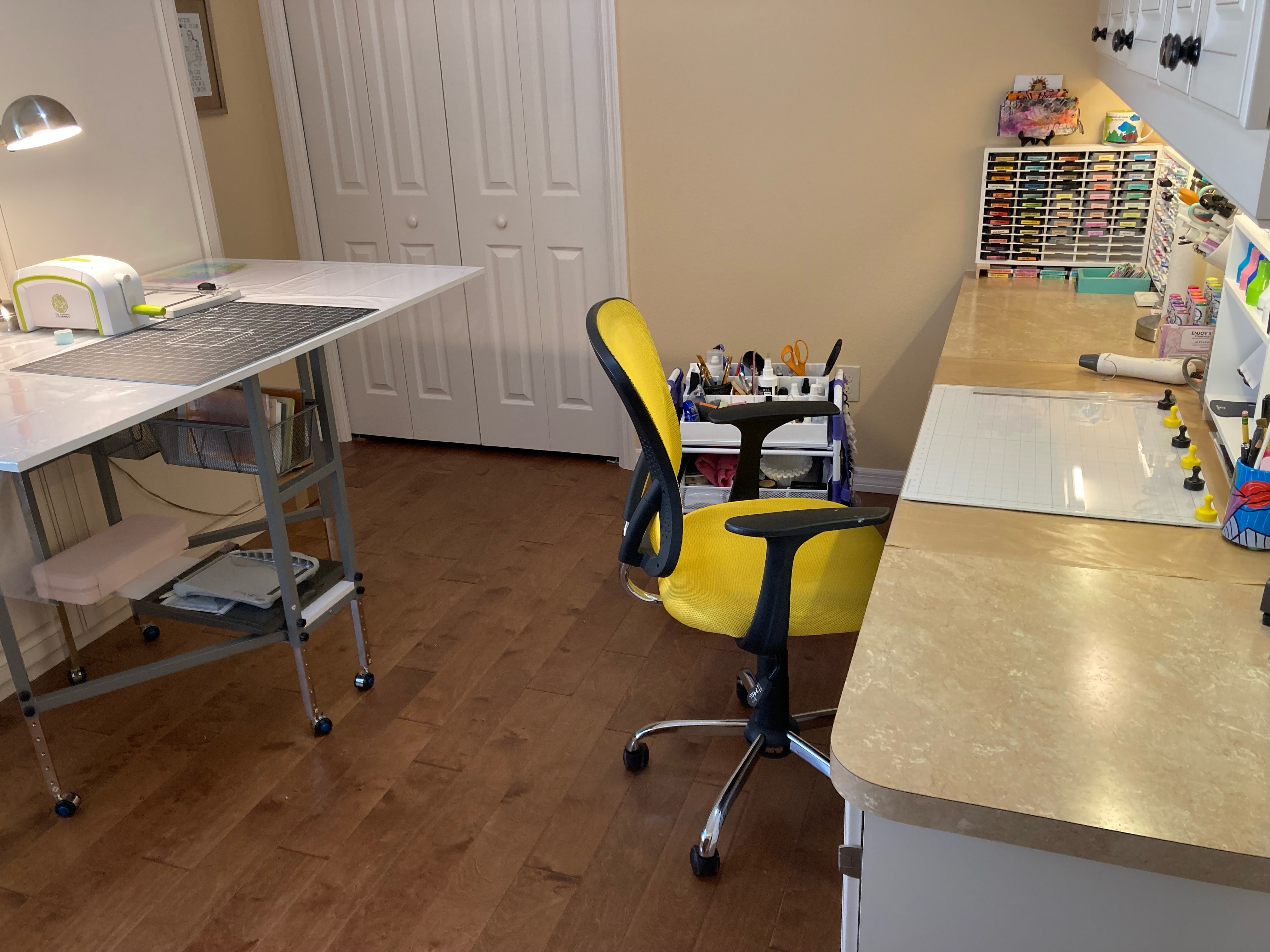 Craft room with desk space, ink pad storage, cutting surfaces and mobile workstation