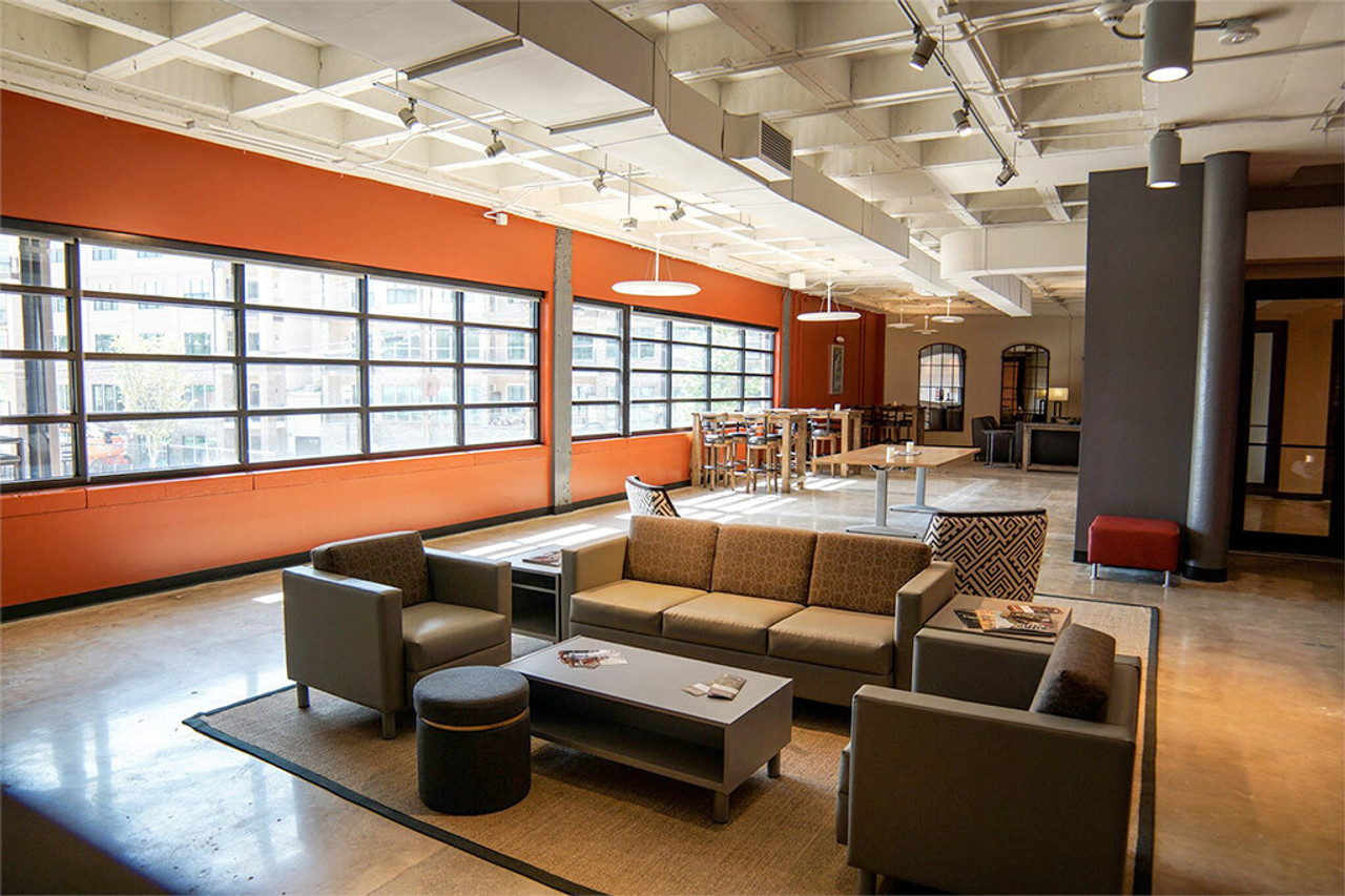 Indoor seating and lounge area at Stoddard's Range and Guns.