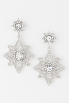 Pair of silver-tone celestial starburst drop earrings featuring intricate geometric star-shaped pendants encrusted with shimmering white crystals and a large center stone against a plain white background.