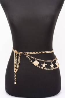 Gold-layered chain belt with starfish and seashell charms on a black mannequin torso.