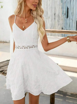 White textured mini dress with floral crochet waist detail.