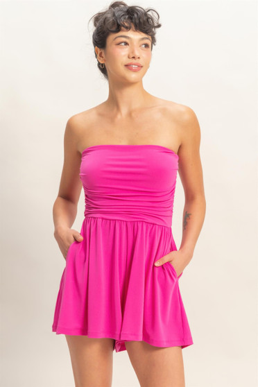 Vibrant pink strapless romper with ruched bodice.