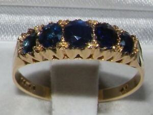 "Vintage 18ct yellow gold five stone sapphire ring with oval cut blue gemstones in a multi-claw setting."