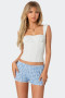 Trendy feminine corset top with a classic dot pattern and structured fit.