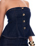Dark wash denim strapless peplum top with gold buttons.