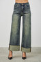 High-rise wide-leg jeans in a vintage indigo wash with oversized cuffed hems.