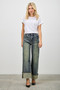 High-waisted wide-leg jeans, vintage blue wash denim with oversized cuffs, women's designer-style denim trousers.