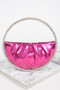 A vibrant metallic pink crescent-shaped handbag with soft ruched pleats and a continuous oversized crystal halo handle.