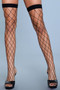 Close-up of legs featuring oversized diamond pattern fishnet hosiery and stay-up thigh-high bands against a neutral background.