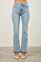 A model wears light blue flare jeans standing against a neutral background. The jeans feature a high waist, five-pocket styling, and a double-toned released hem at the bottom.
