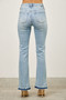 Women’s high-waisted flare jeans with raw edge released hemline.
