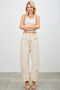 Front view of women's high-waisted sculpted wide-leg pants in a neutral sand wash.