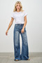 Retro-inspired wide-leg jeans with side button placket for a custom split-leg look.