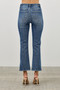 Medium-wash cropped jeans with subtle whiskering at the hips and a slight flare at the hem, featuring functional brass-tone zippers at the side slits.