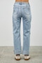 "High-waisted light wash denim jeans with raw-edge cuffs and dark blue star and heart patchwork details."