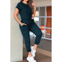 One-piece athleisure jumpsuit with short sleeves and functional cargo pockets.