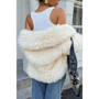 "Transition weather outerwear: a plush shaggy coat perfect for cool autumn days or cold winter nights."