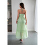 "Women's elegant tiered sun dress with v-neckline and textured fabric."