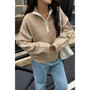 "Preppy style collared half-zip knit pullover with drop shoulders and contrast trim."