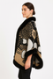 Front view of a model wearing a luxurious open-front poncho with plush black faux-fur collar and cuffs and a modern geometric print.