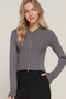 Close-up of a charcoal grey ribbed knit zip-up hoodie for women.