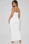 Versatile base-layer maxi dress styled with clear heels for a modern look.