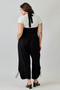 Versatile black everyday jumpsuit with adjustable drawstring hem.