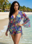 Blue mesh beach romper with bell sleeves and tropical leaf patterns.