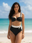 High-waisted black and white bikini set with tie-waist detail.