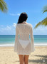 Sheer white crochet dress for tropical vacations and beach clubs.