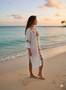 Midi-length linen beach tunic with bell sleeves and granny square details.