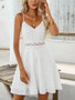 Boho-style white dress with lace midriff and spaghetti straps.