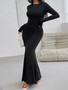 "Close-up of a long-sleeve formal dress showing the elegant boat neck and curve-hugging silhouette."