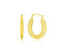 Featuring a weave like texture, these oval shape hoop earrings are made of 10k yellow gold. Secured with snap backs.