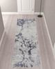 3' x 10' Ivory and Blue Abstract Power Loom Distressed Runner Rug