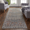 3' x 10' Tan Blue and Orange Floral Power Loom Distressed Runner Rug with Fringe